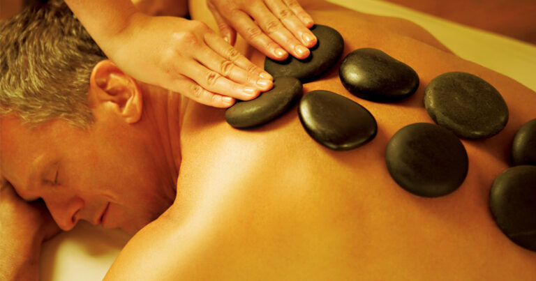 Hot stone massage add-on at iOnyx Medspa in Merritt Island FL for deep muscle relief and relaxation
